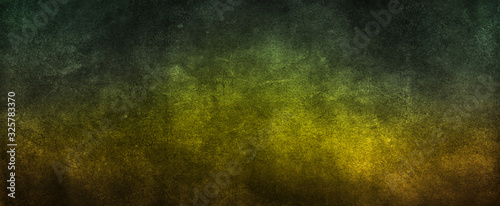 Abstract yellow green background with soft bright gold center glowing with light colors and dark blue green border with blurred mottled texture