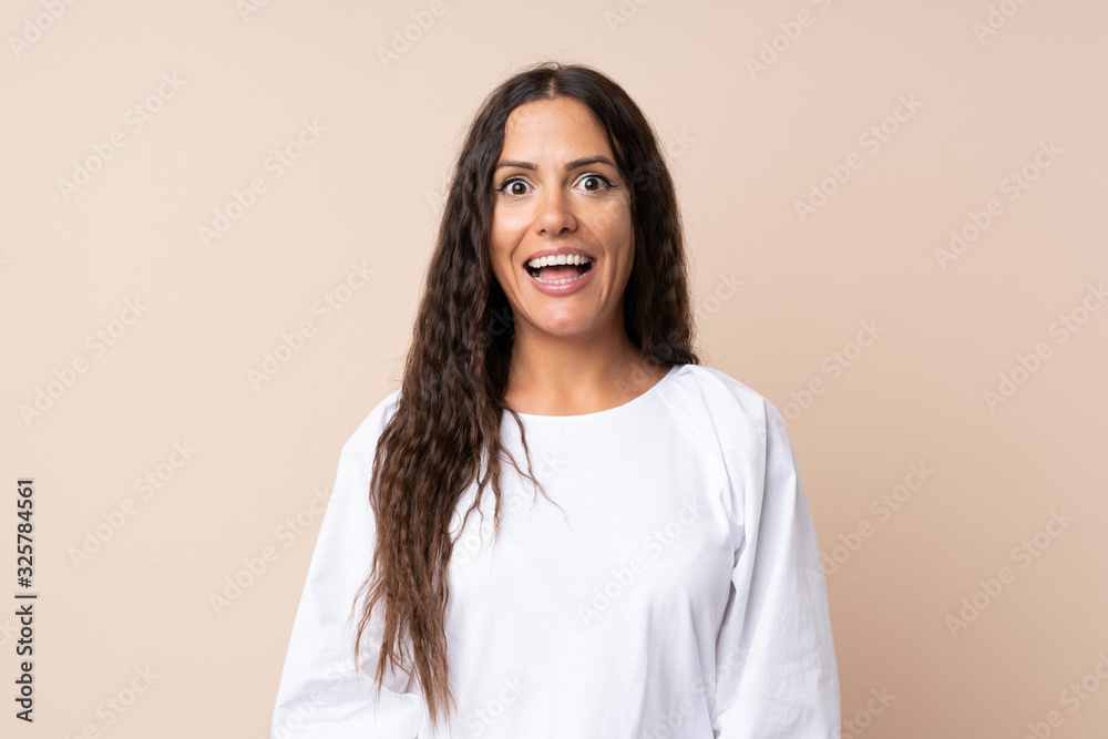 Young woman over isolated background with surprise facial expression Young woman over isolated background with surprise facial expression