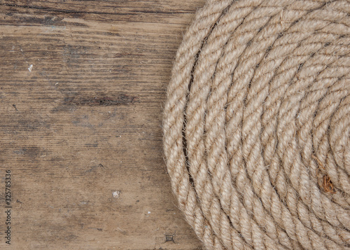 Vintage background with wooden log and hemp rope
