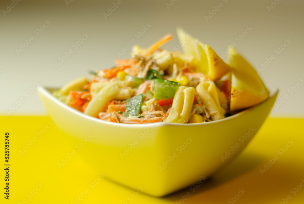 Cavatelli pasta with tuna and iceberg lettuce, carrots, sweet corn and cucumber in a sauce mayonnaise Cavatelli pasta with tuna and iceberg lettuce, carrots, sweet corn and cucumber in a sauce mayonnaise