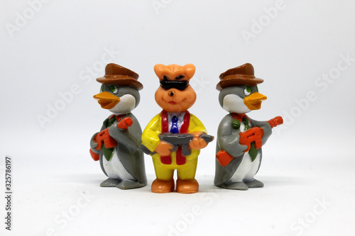 Illegal profit and black cash. Mafia business. Three mascot holding gun and a boxer mascot. Illegal protection. Money laudry. Destruction, fear, brutal power. Killer or murder concept. photo