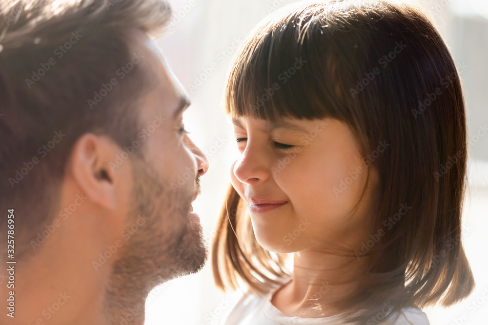 Close up of dad make surprise playing with little daughter Close up of dad make surprise playing with little daughter