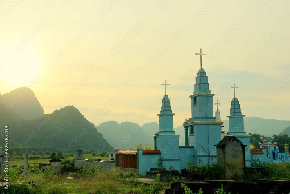 Sunset on a christian cemetery in  Phong Nha Khe Bang National Park, Vietnam