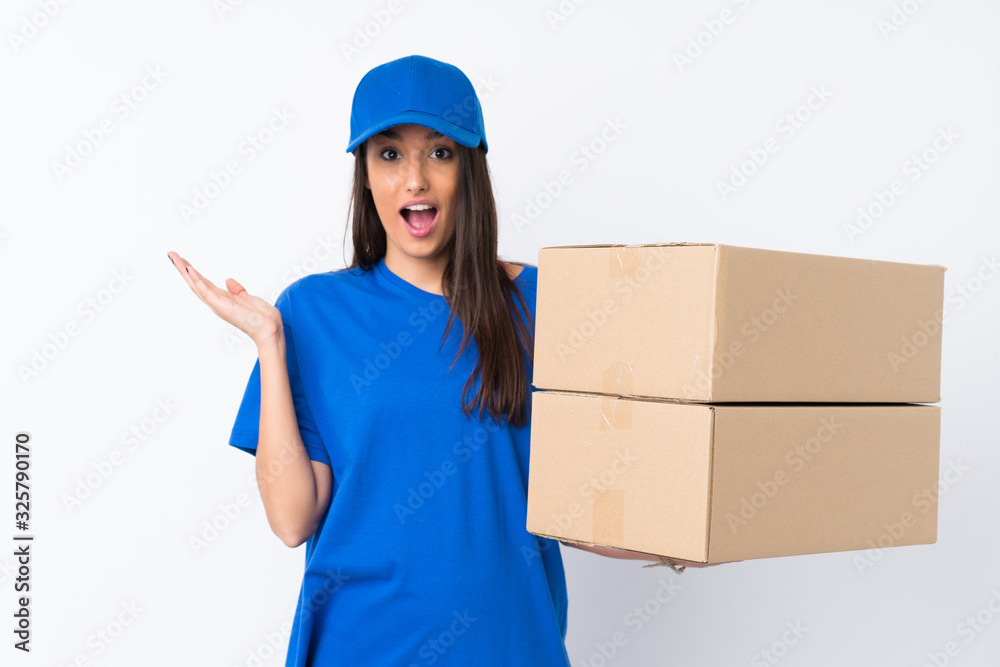 Young delivery woman over isolated white background with surprise facial expression Young delivery woman over isolated white background with surprise facial expression