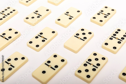 Photo of different dominoes. Background of dominoes. Hobbies collecting on white background.