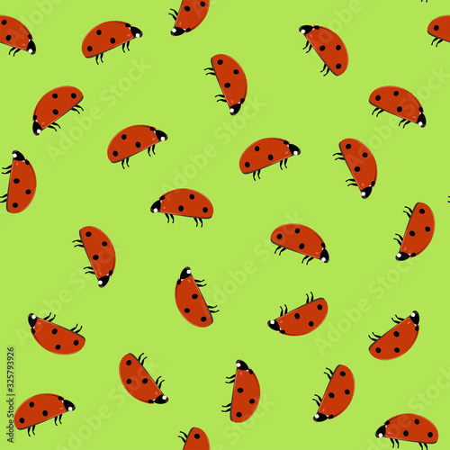 Seamless pattern with ladybugs on green background. Flat vector illustration.