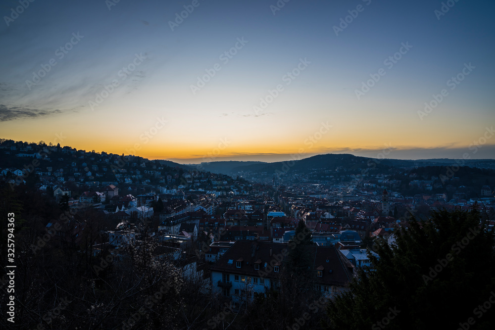 Germany, Stuttgart, View above skyline and houses from above in sunset  light