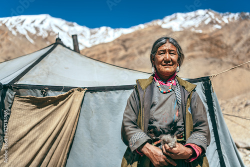 Nomadic old Woman. They live for several months a year in tents, looking for fresh pastures for their goats, from which comes cashmere wool. In Ladakh, Kashmir, India. photo