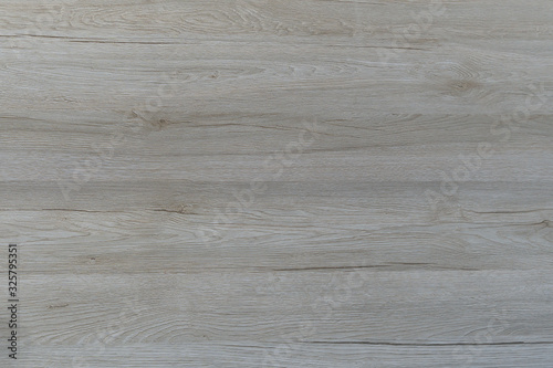 Laminate made of natural wood for the floor. Tile modern design for wall view wood. Blank for the designer, wooden background with texture. The horizontal arrangement, the color of the boards is gray.