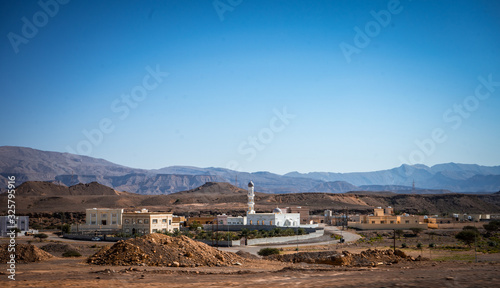 Mosque with a mountain in the background towards Sur, Oman