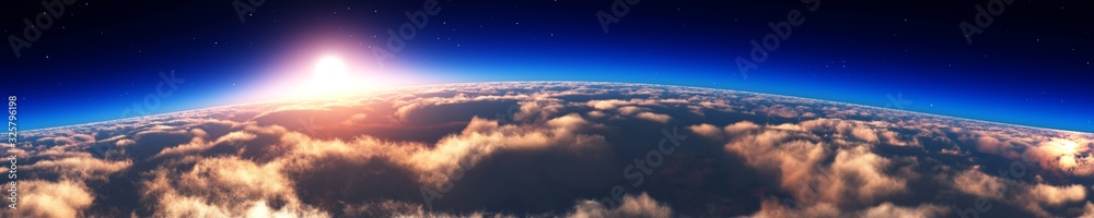 Sunrise over the planet. Panorama of clouds under the sun. 