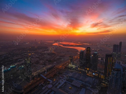 Dubai skyline aerial view at sunrise. Beautiful landscape of United Arab Emirates modern city from above.