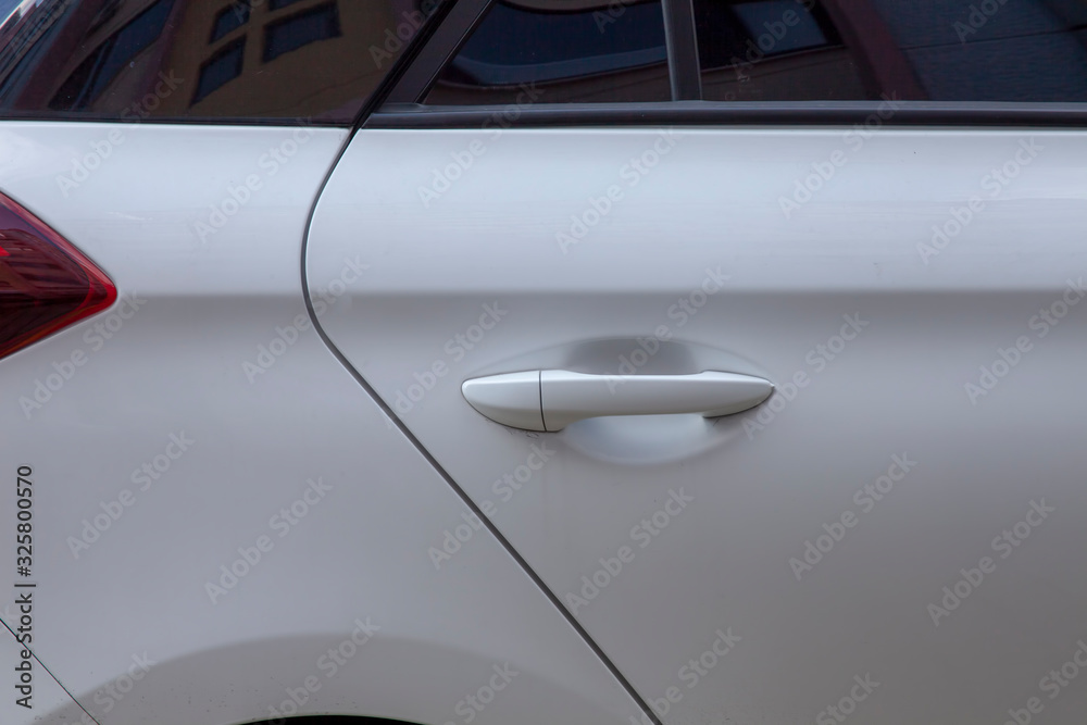white car door handle close up