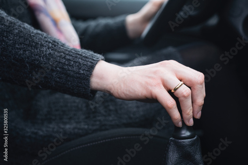 Woman Driving a Car with a Manual Transmission