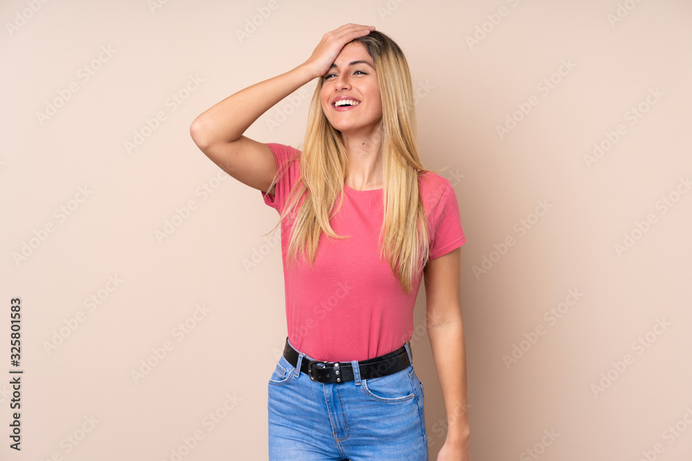 Young Uruguayan woman over isolated background smiling a lot Young Uruguayan woman over isolated background smiling a lot