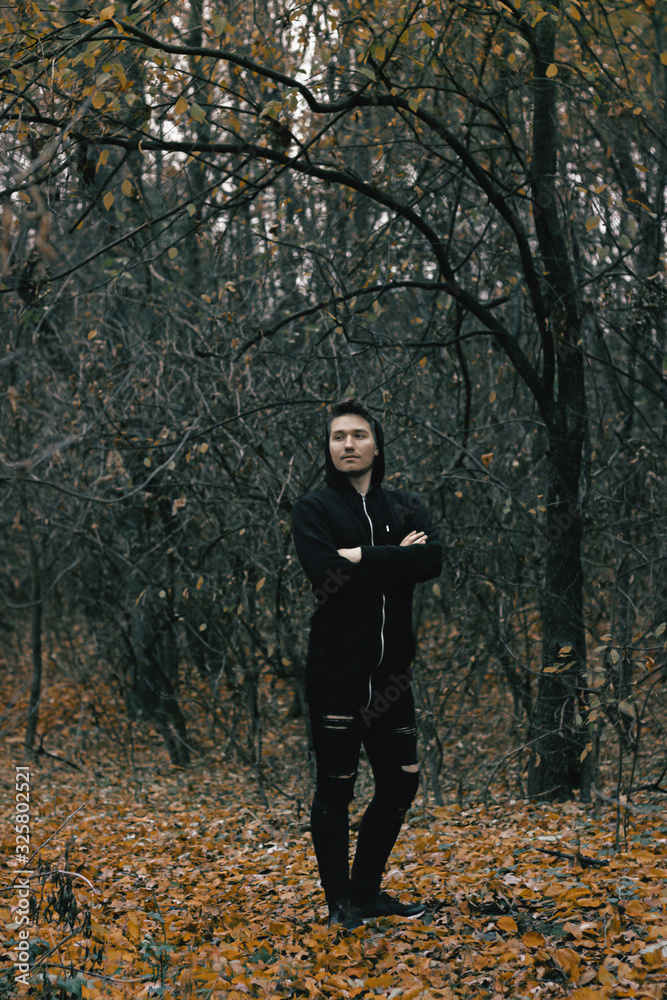 a guy relaxing in forest at day a guy relaxing in forest at day