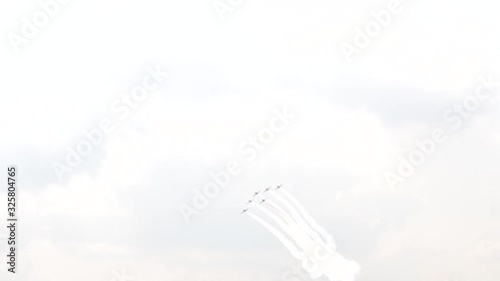 A jet fighter makes a figure 