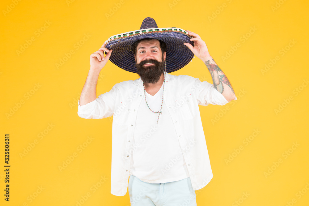 Maintain tradition. celebrating fiesta. happy man wear poncho. having fun on party. sombrero party man. man in mexican sombrero hat. Celebrate traditions. hipster with beard looks festive in sombrero Maintain tradition. celebrating fiesta. happy man wear poncho. having fun on party. sombrero party man. man in mexican sombrero hat. Celebrate traditions. hipster with beard looks festive in sombrero
