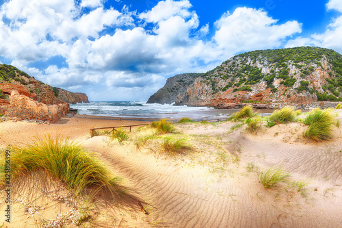 Charming view of beach Cala Domestica with marvelous sand dunes.