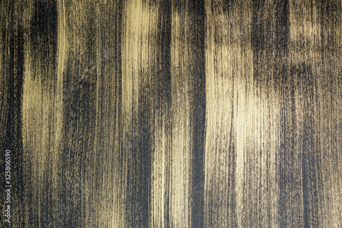 Metal surface with black brush strokes over light background, grunge abstract background.