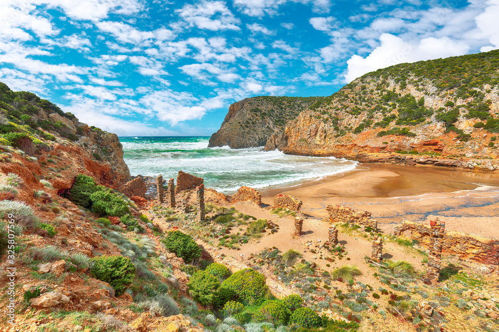 Stunning view of valley Cala Domestica  with marvelous sand beach and ruines of old village
