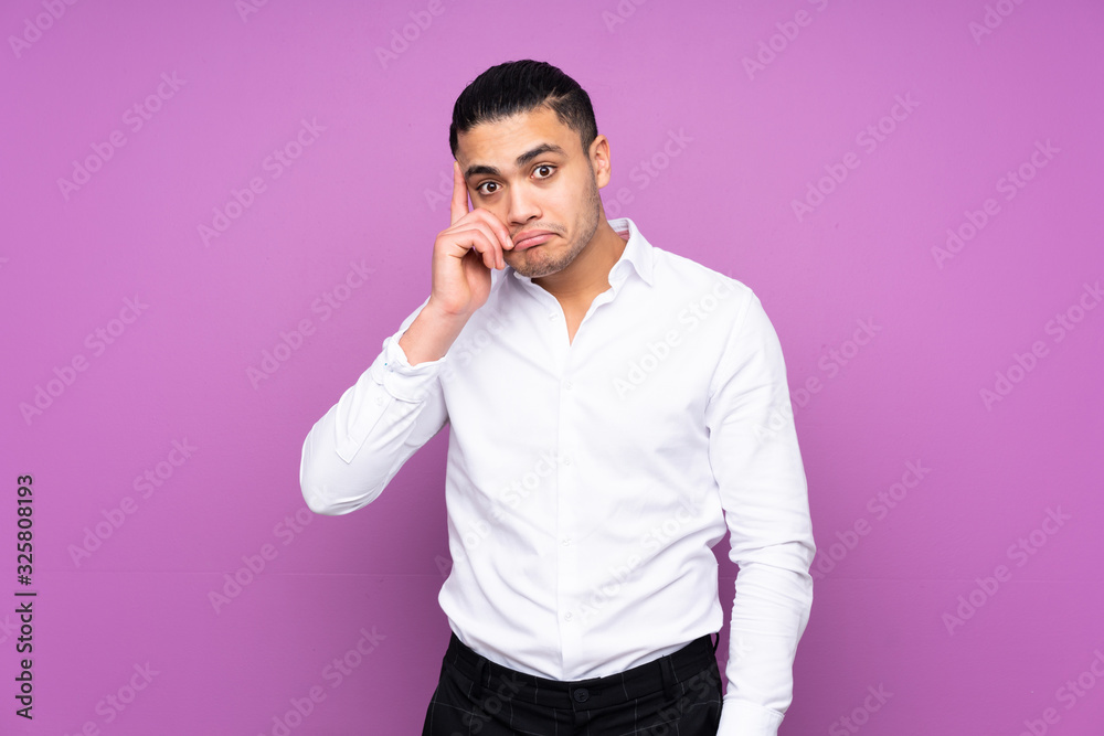 Asian handsome man isolated on blue background thinking an idea Asian handsome man isolated on blue background thinking an idea