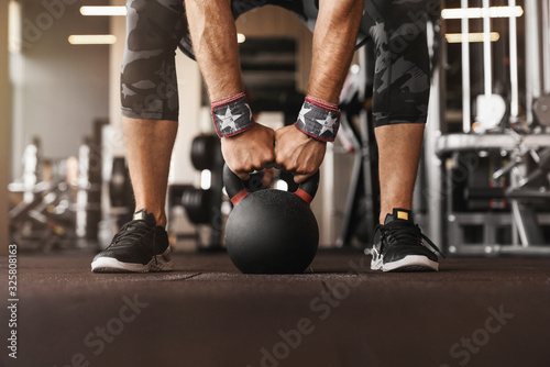 Fototapeta Naklejka Na Ścianę i Meble -  Close up photo of man strength workout training with dumbbells