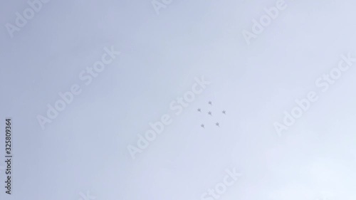 A jet fighter makes a figure 
