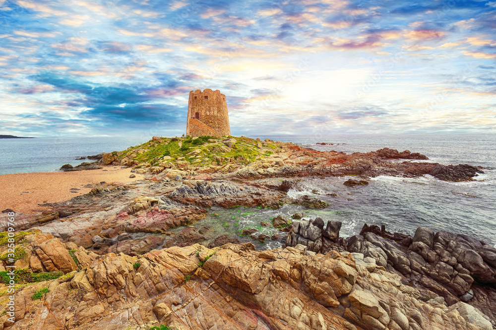 Fantastic sunset view of Bari Sardo tower in the Gulf of Orosei.