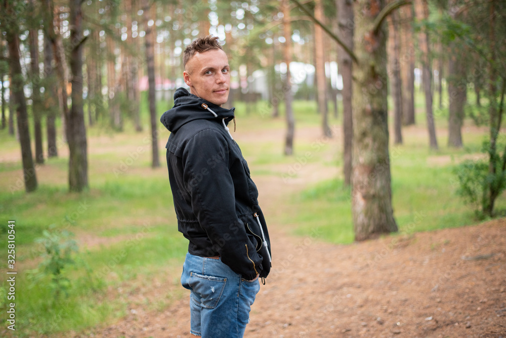 A man in the cold season, in the forest. A man in the cold season, in the forest.