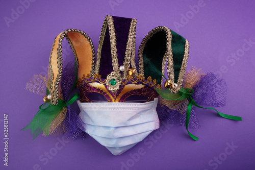 Corona virus and Venice carnival. Epidemic virus. Carnival mask with protective mask photo