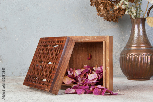 Vintage wooden aroma box on concrete background.