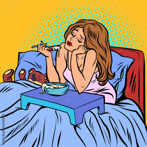 woman eating porridge. Breakfast in bed