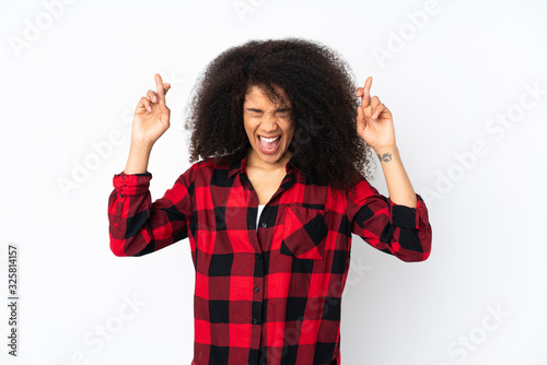 Young african american woman over isolated background with fingers crossing