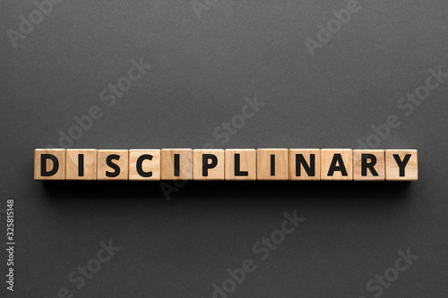 Photos Disciplinary - words from wooden blocks with letters, enforcing discipline, disc
