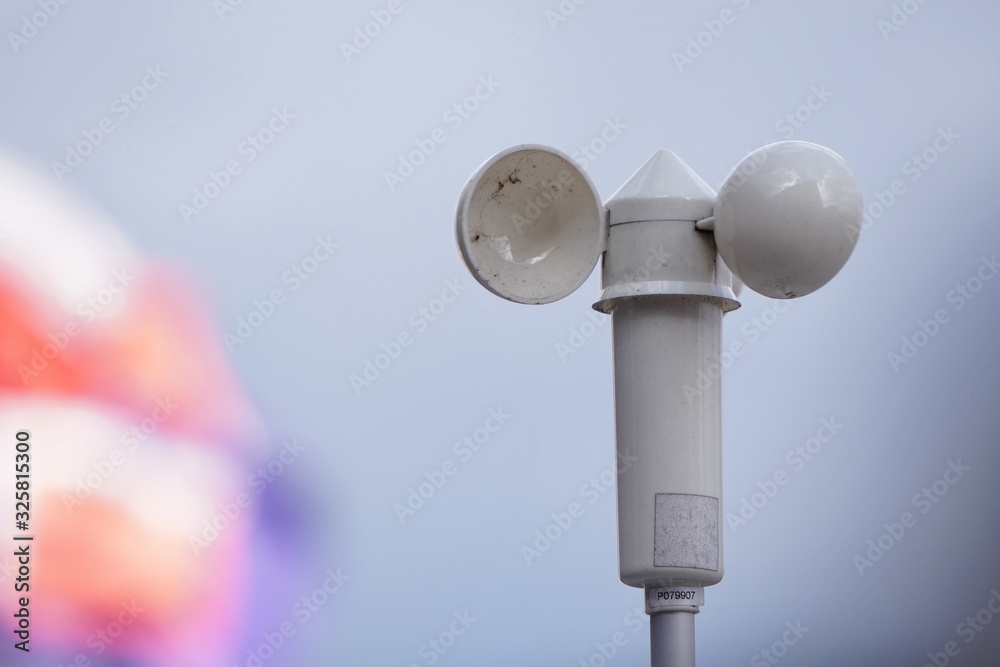 White mechanical wind speed and pressure sensor-anemorumbometer. White mechanical wind speed and pressure sensor-anemorumbometer.