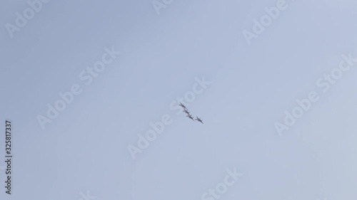 A jet fighter makes a figure 