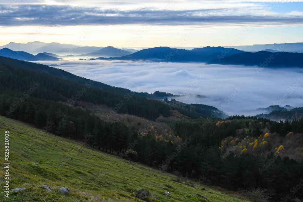 Zalla Valley covered with fog with Mount Gorbea at sunrise