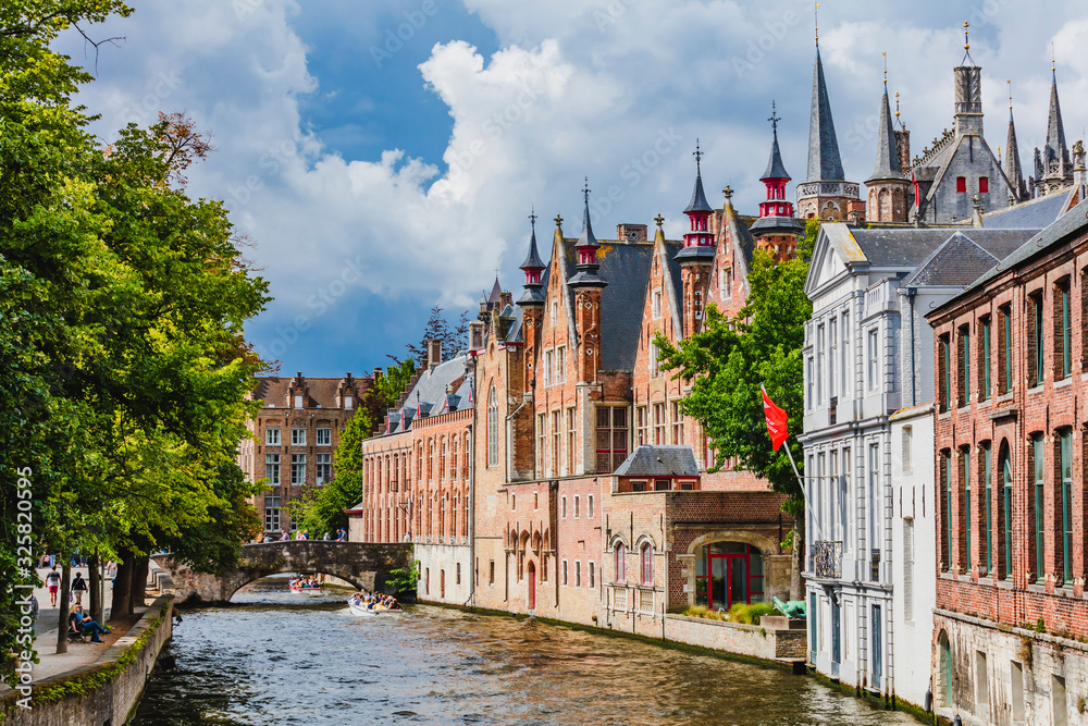 View of Bruges old town reflecting in the water canal, Belgium View of Bruges old town reflecting in the water canal, Belgium