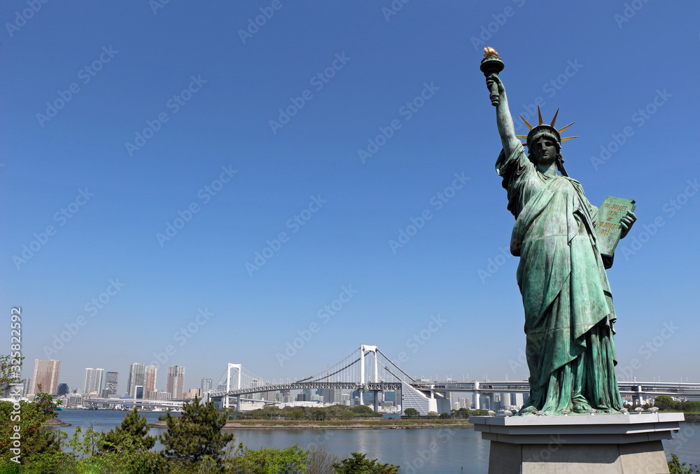 Statue of Liberty and the Rainbow Bridge in Odaiba, Tokyo
