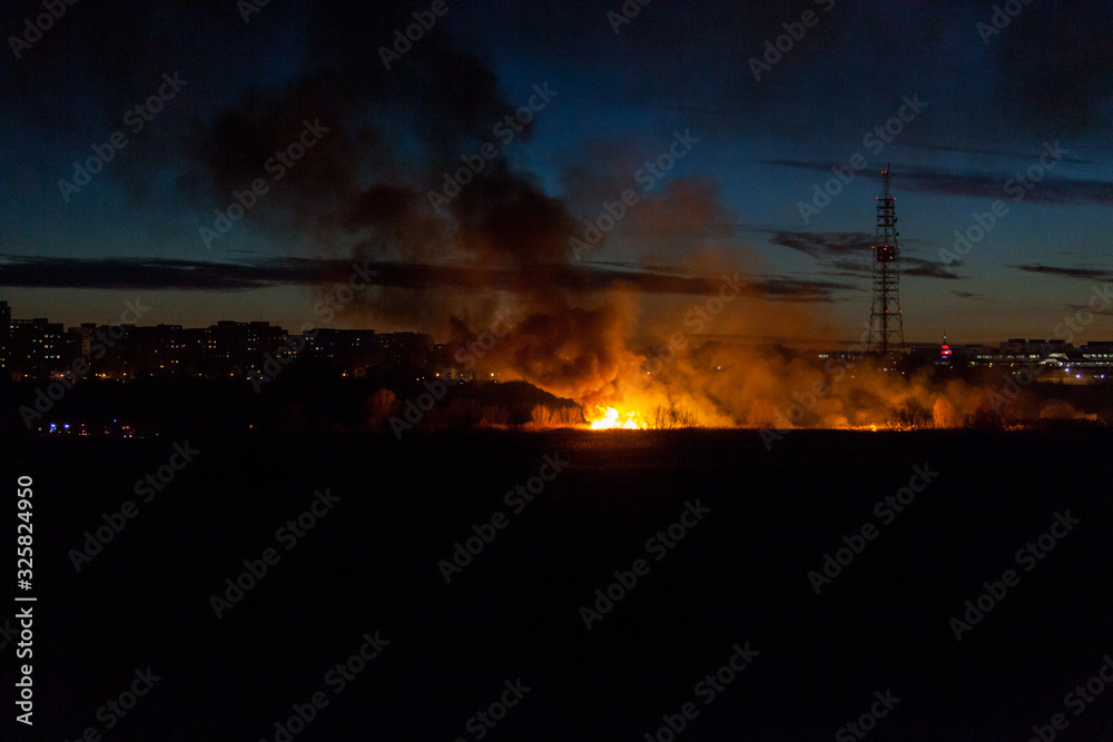 Bucharest, Romania- 02 24 2020: Huge bush fire in Delta Vacaresti- Parcul Natural Vacaresti , over 5 ha of vegetation burned down, fanned by strong winds. People were watching from the distance. Bucharest, Romania- 02 24 2020: Huge bush fire in Delta Vacaresti- Parcul Natural Vacaresti , over 5 ha of vegetation burned down, fanned by strong winds. People were watching from the distance.