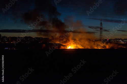 Bucharest, Romania- 02 24 2020: Huge bush fire in Delta Vacaresti- Parcul Natural Vacaresti , over 5 ha of vegetation burned down, fanned by strong winds. People were watching from the distance. 