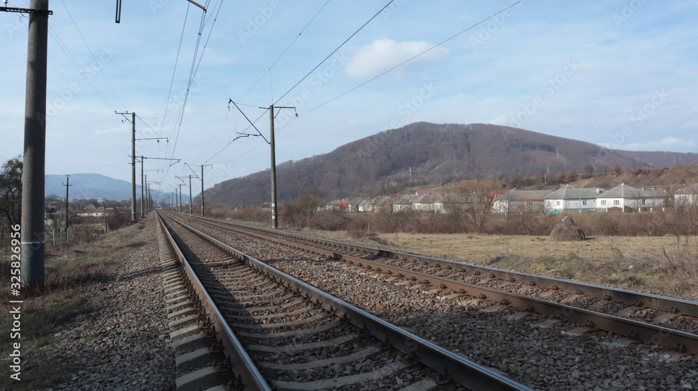 rails, sleepers, railway and poles along the tracks rails, sleepers, railway and poles along the tracks