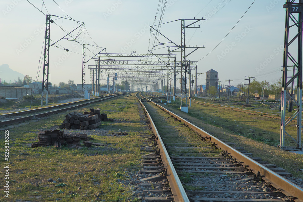 Railroad tracks . Straight railway line . Empty summer railway . local railway and train station . Railroad tracks . Straight railway line . Empty summer railway . local railway and train station .
