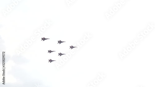 A jet fighter makes a figure 