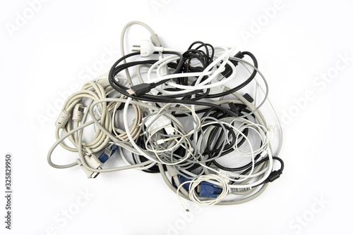 Tangled roll of computer wires on a white background