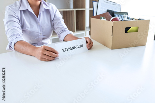 Stress of business woman employee intend to sending resignation letter to boss employer consider in order to contract for quit or layoff of job leaving from work, resignation concept © Thitiphat