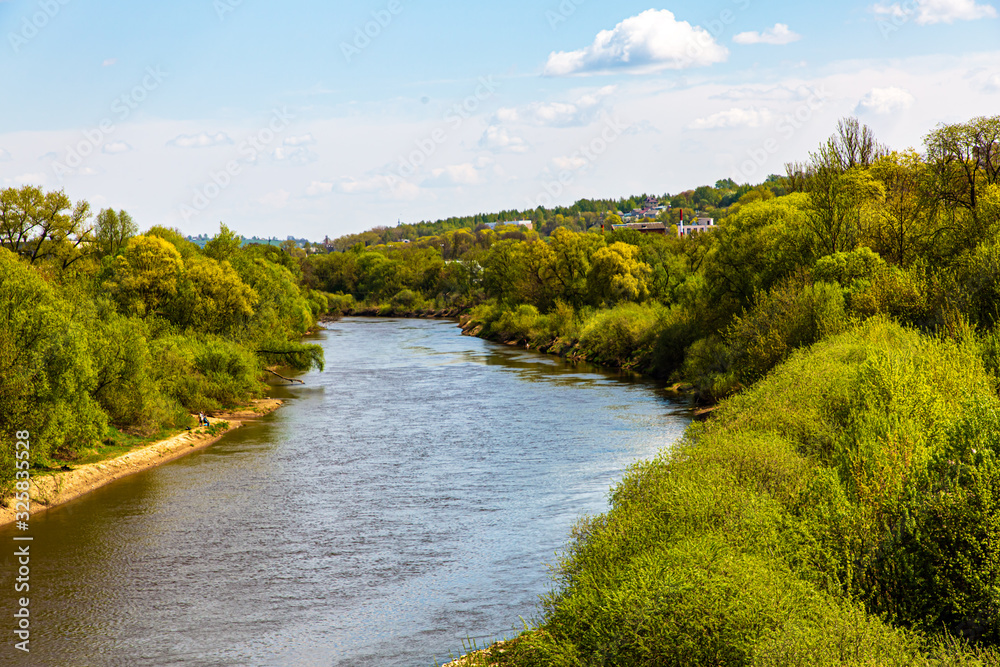 Smooth bend of the river. Traditional Russian landscape. Summer.