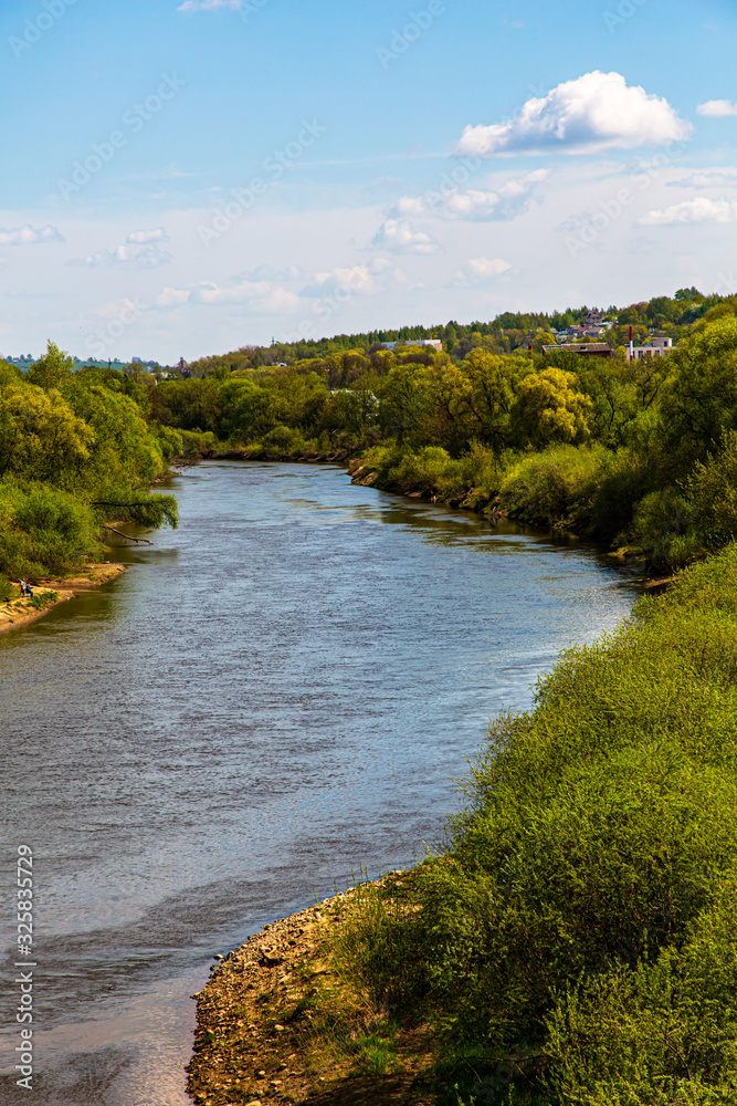 Smooth bend of the river. Traditional Russian landscape. Summer.