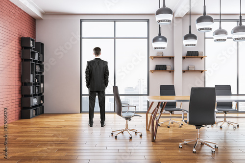 Businessman standing in boardroom office room